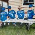 Oil Painting of young boys in baseball gear sitting.